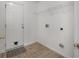 The laundry room has vinyl tile flooring, access to the exterior, and shelving for storage at 4977 Ballantine Dr, Summerville, SC 29485
