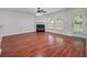 Bright living room with fireplace and ceiling fan, perfect for entertaining or relaxing with Gathering and friends at 4977 Ballantine Dr, Summerville, SC 29485