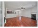 Open-concept living room with fireplace flows into a modern kitchen, creating an ideal space for entertaining and Gathering time at 4977 Ballantine Dr, Summerville, SC 29485