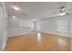 Bright living room with hardwood floors, ceiling fan, white walls and natural light at 4977 Ballantine Dr, Summerville, SC 29485
