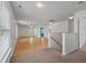 The living space offers hardwood flooring, and a view of an en suite bathroom at 4977 Ballantine Dr, Summerville, SC 29485