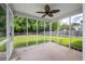 Screened porch with ceiling fan overlooking spacious backyard at 4977 Ballantine Dr, Summerville, SC 29485