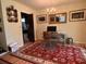 Office room with a wood desk, patterned red oriental rug, and natural light at 5 Apple Cir, Goose Creek, SC 29445