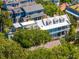 Stunning home with white balconies and a matching roof, surrounded by mature trees in a charming neighborhood at 5 Legare St # C, Charleston, SC 29401