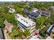 Beautiful Charleston home with multiple balconies and a light-colored roof nestled in a lush neighborhood at 5 Legare St # C, Charleston, SC 29401
