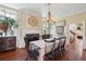 Classic dining room featuring dark wood furniture, elegant lighting, and traditional decor at 5 Legare St # C, Charleston, SC 29401