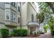 Stately home with a private drive, balcony, manicured landscaping, and an inviting covered entryway at 5 Legare St # C, Charleston, SC 29401