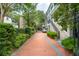 Charming brick driveway lined by lush hedges leads to the stately homes at 5 Legare St # C, Charleston, SC 29401