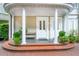 Charming front entrance featuring double doors, columns, and manicured greenery at 5 Legare St # C, Charleston, SC 29401
