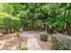 Backyard featuring a brick pathway and secluded patio area at 5002 W Liberty Meadows Dr, Summerville, SC 29485