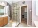 Accessible bathroom featuring a glass shower, double vanity, and access to the walk-in closet at 5002 W Liberty Meadows Dr, Summerville, SC 29485