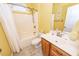 Bathroom featuring yellow walls, tiled floor, white shower and a vanity with a sink at 5002 W Liberty Meadows Dr, Summerville, SC 29485