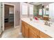 Bathroom featuring a double vanity with wood cabinets and a shower at 5002 W Liberty Meadows Dr, Summerville, SC 29485