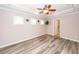 Light-filled bedroom with tray ceilings, ceiling fan, and access to the ensuite bathroom at 5002 W Liberty Meadows Dr, Summerville, SC 29485