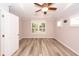 Bedroom with tray ceilings, ceiling fan, and a large window allowing natural light at 5002 W Liberty Meadows Dr, Summerville, SC 29485