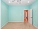 Bedroom featuring carpet, light blue walls, and a white door with a doorway at 5002 W Liberty Meadows Dr, Summerville, SC 29485