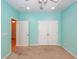 Bedroom featuring carpet, light blue walls, and double doors with a doorway at 5002 W Liberty Meadows Dr, Summerville, SC 29485