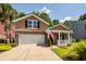 Charming two-story home with a brick facade, manicured lawn, and a welcoming front porch at 5002 W Liberty Meadows Dr, Summerville, SC 29485