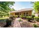 Back exterior showing the patio and landscaped yard at 5002 W Liberty Meadows Dr, Summerville, SC 29485