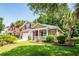 Charming two-story home with brick accents, front porch, attached garage, and manicured lawn at 5002 W Liberty Meadows Dr, Summerville, SC 29485