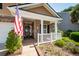 Inviting front porch with white railing, brick accents, and a welcoming entrance to the home at 5002 W Liberty Meadows Dr, Summerville, SC 29485