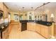 Large kitchen with granite countertops, wood cabinets, and stainless steel appliances at 5002 W Liberty Meadows Dr, Summerville, SC 29485