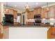 Charming kitchen with black appliances, breakfast bar, and decorative light fixtures at 5002 W Liberty Meadows Dr, Summerville, SC 29485