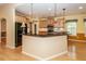 Kitchen with island, black appliances, granite countertops, and wood cabinets at 5002 W Liberty Meadows Dr, Summerville, SC 29485
