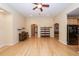 Open-concept living room with hardwood floors, ceiling fan, and view to kitchen at 5002 W Liberty Meadows Dr, Summerville, SC 29485