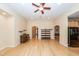 Bright living room boasts hardwood floors, neutral paint, and modern ceiling fan at 5002 W Liberty Meadows Dr, Summerville, SC 29485