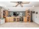 Inviting living room with custom built-ins, beverage fridge, and entertainment center at 5002 W Liberty Meadows Dr, Summerville, SC 29485