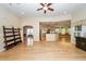 Spacious living room with hardwood floors that opens to kitchen and dining area at 5002 W Liberty Meadows Dr, Summerville, SC 29485