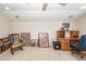 Bright living room featuring a cozy reading nook with a rocking chair and built-in bookcase at 5002 W Liberty Meadows Dr, Summerville, SC 29485