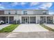 Townhome backyard with an enclosed porch and a concrete driveway area at 502 Duskywing Dr, Goose Creek, SC 29445