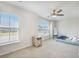 Bedroom with carpet, ceiling fan and two windows offering an outdoor view at 502 Duskywing Dr, Goose Creek, SC 29445