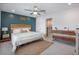 Serene bedroom featuring stylish décor, ceiling fan, and ample natural light for a relaxing retreat at 502 Duskywing Dr, Goose Creek, SC 29445