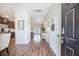 Welcoming foyer with hardwood floors and an open view to the kitchen and dining area at 502 Duskywing Dr, Goose Creek, SC 29445