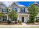 Charming two-story townhouse with well-maintained landscaping and inviting front porch at 502 Duskywing Dr, Goose Creek, SC 29445