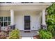 Charming front porch with stone pillars and a cozy seating area, perfect for relaxing outdoors at 502 Duskywing Dr, Goose Creek, SC 29445