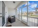 Screened in porch with seating, a view of the neighborhood, and outdoor access at 502 Duskywing Dr, Goose Creek, SC 29445