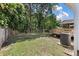 Expansive backyard featuring a wooden deck, lush trees, and ample green space for outdoor activities and recreation at 5052 Hidden Forest Ln, North Charleston, SC 29420