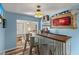 Custom bar with unique decor, including a Budweiser mirror and shelving for drinks at 5052 Hidden Forest Ln, North Charleston, SC 29420