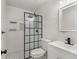 Modern bathroom featuring black fixtures, a tiled shower, and vanity with stylish mirror at 5052 Hidden Forest Ln, North Charleston, SC 29420