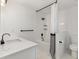 Well-lit bathroom features a shower over tub and a modern vanity with a stylish faucet at 5052 Hidden Forest Ln, North Charleston, SC 29420