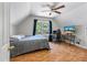 A cozy bedroom with a workspace features natural light and a comfortable bed at 5052 Hidden Forest Ln, North Charleston, SC 29420