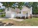 Well-maintained two story home with siding, garage, and front lawn at 5052 Hidden Forest Ln, North Charleston, SC 29420