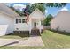 Charming two story home with siding, front porch, and front lawn at 5052 Hidden Forest Ln, North Charleston, SC 29420