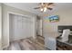 Versatile space ideal for a home office with a ceiling fan and convenient closet storage at 5052 Hidden Forest Ln, North Charleston, SC 29420