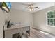 Functional home office with a modern desk, chair, and a window providing natural light at 5052 Hidden Forest Ln, North Charleston, SC 29420