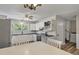 Bright eat-in kitchen featuring white cabinets, black countertops, and stainless appliances at 5052 Hidden Forest Ln, North Charleston, SC 29420